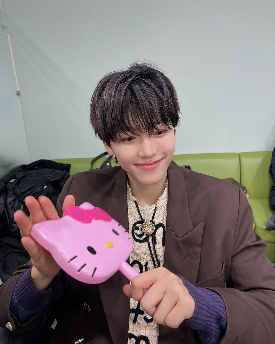 The angle says 'cool,' the vibe says 'soft boy,' and with a full smile for the finale, Miss Hello Kitty and I are the perfect team—co-hosting a show doesn’t seem too far off, right?