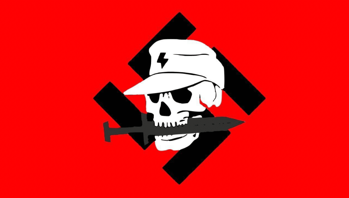 TracTerrorism's tweet photo. 🔥 TRACWatch Weekly Insight: "#Atomwaffen to Ashes: The Collapse of the #NSRF" 🚨
Explore the fall of the final successor, its implications, and where radicalised members might go next.
Read the full analysis here: https://t.co/aya0haVhbH #Extremism #NSRF #TRACWatch https://t.co/Q2zKMCtIbw