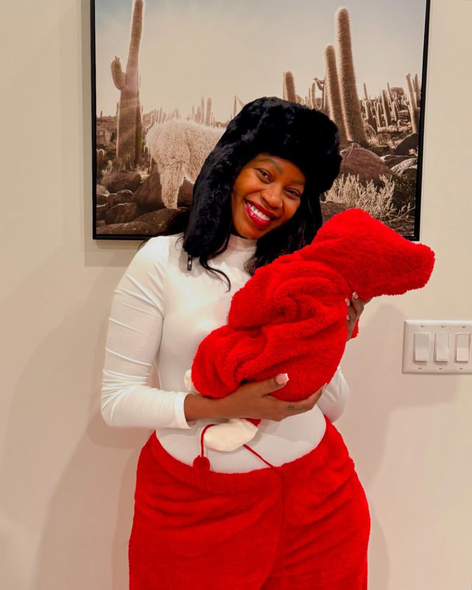tfm_964's tweet photo. Sheebah Karungi poses
 with a newborn. #TFMNEWSUPDATE https://t.co/mliuLhRjiZ