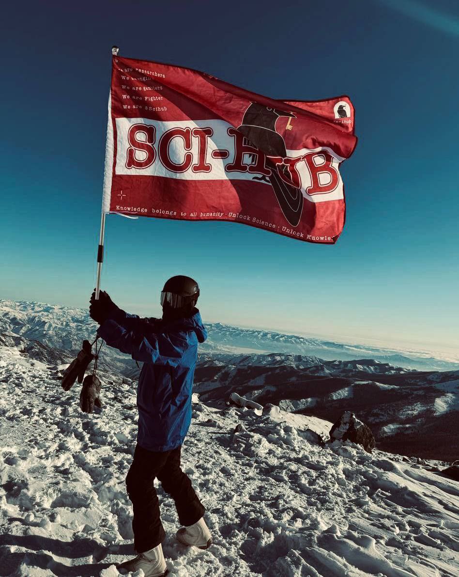 SciHubFans's tweet photo. Unlock science, conquer the peaks! 🐦‍⬛🔥

the Sci-Hub flag just flew high on a snowy mountain, carried by one of our incredible community members. this is more than a movement, it’s a revolution!!! 

together, we’re unstoppable, from the mountains to the stars! 🏔️🚀✨

#DeSci  #SciHub