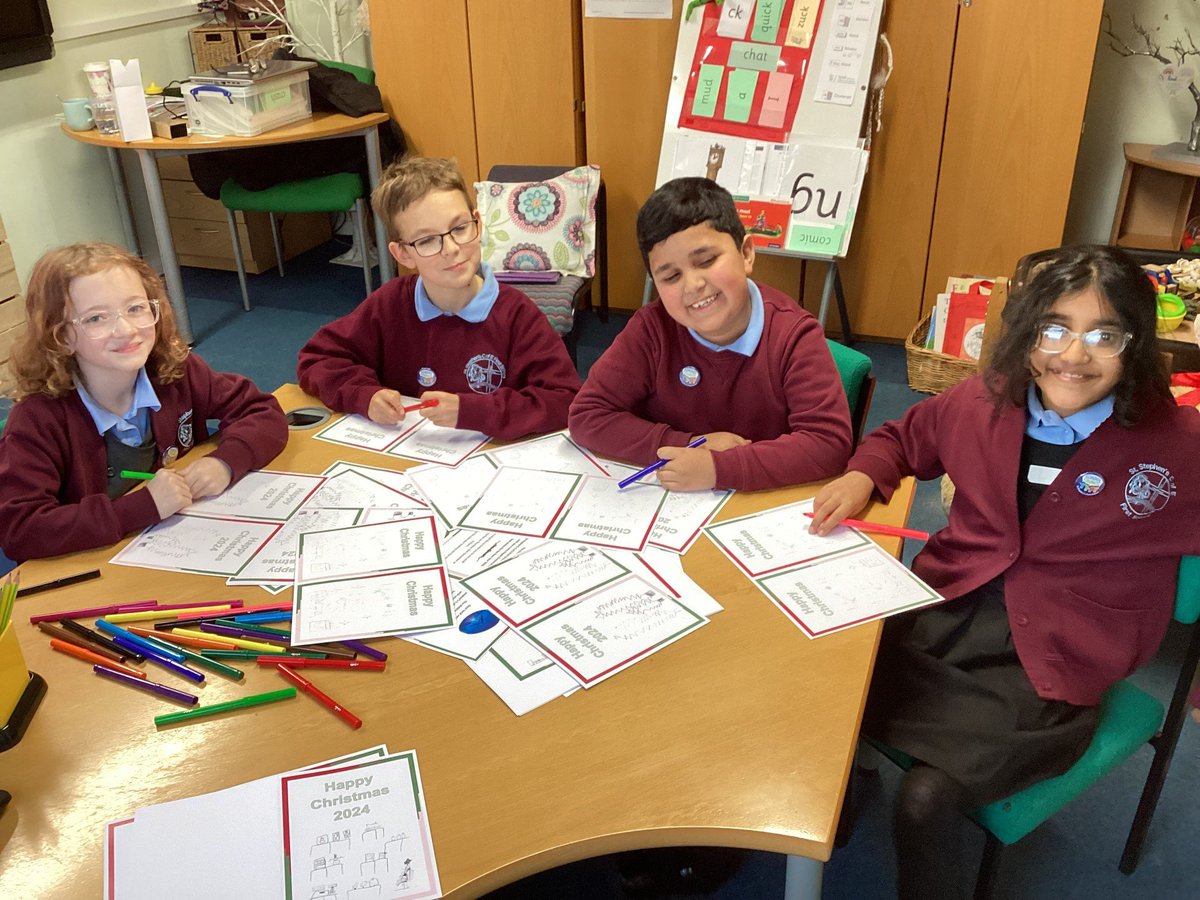 School Council working hard to spread some joy writing Christmas cards for the community!