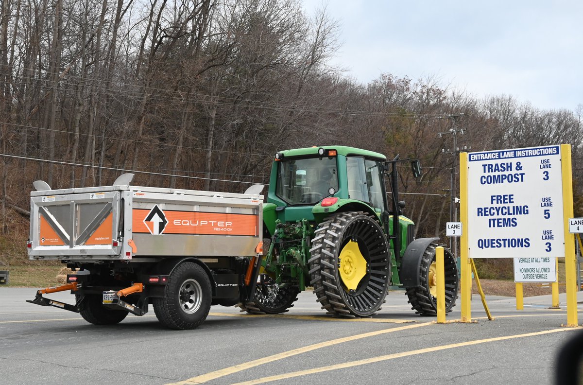 ChesterCSWA's tweet photo. Something we don't see every day - a John Deere tractor with steel wheels pulling a roofer's box full of old shingles. https://t.co/UaSbeJAziw