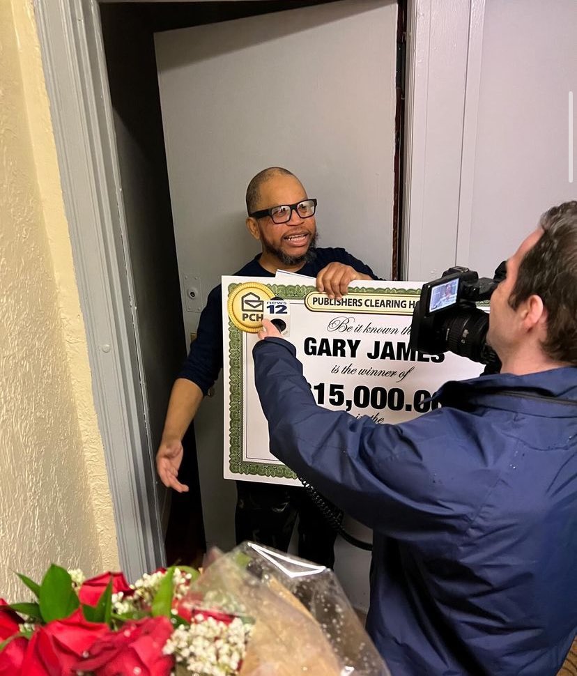 The rain was pouring outside, but the sun was shining inside winner Gary's apartment in the Bronx today!
After a few knocks, Gary opened the door with a stunned look on his face before shouting, "PCH!" The timing was good - as he was just about to go to sleep after his overnight