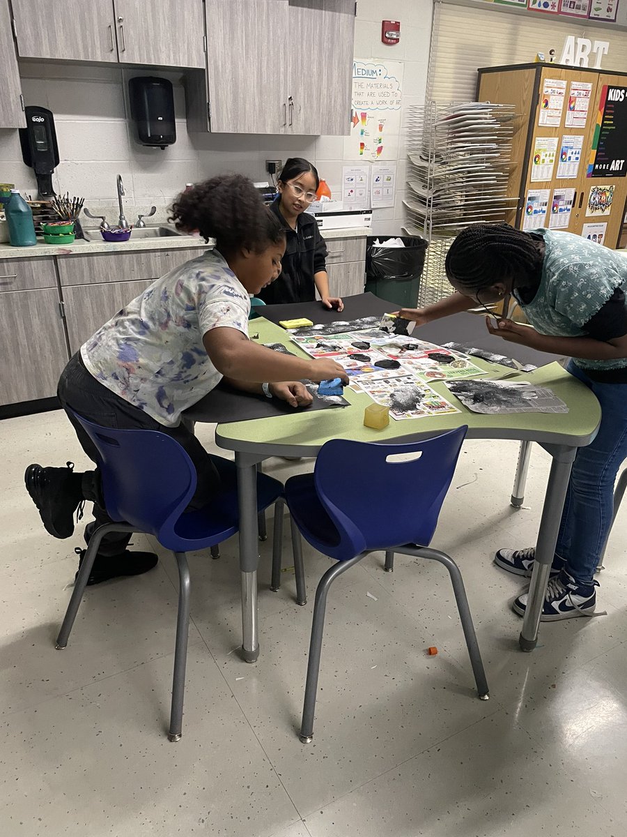 Using a sponge and paint, 5th grade Art Club started their brick backgrounds for their graffiti art. #stony126