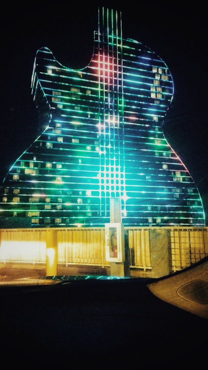 stanmade's tweet photo. I'd known this #largerthanlife, #guitar shaped #casino &amp; #resort from stock photos &amp; #travel brochures, but was never sure where it might be, suspecting it in the #Caribbean or in #Oklahoma. I can tell you tonight that this is the #Seminole #HardRockCafé in #Hollywood, #Florida. https://t.co/hlWpDlYKOg