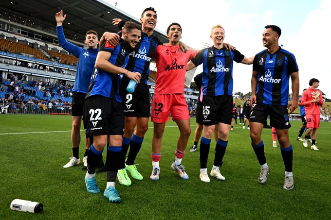 Auckland City FC players celebrate.