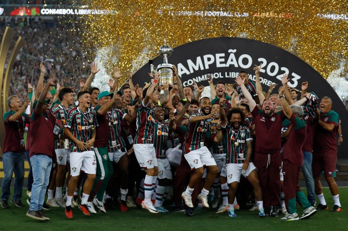 Fluminense FC celebrate with the CONMEBOL Libertadores trophy.