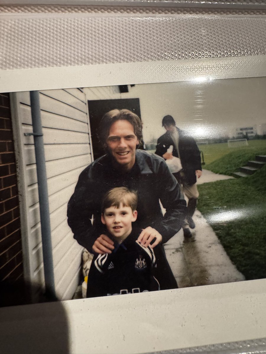 SHAMBAS_'s tweet image. Just found an old photo book. Fucking belta. Two of the big lads no longer with us. I have Speedo’s signed shirt from a 1-0 Derby game in ‘01 where I was ball-boy so getting that framed. Can’t wait! 

And who knew I’d chore @warrenbarton2 curtain haircut 20 year later 😂 #NUFC