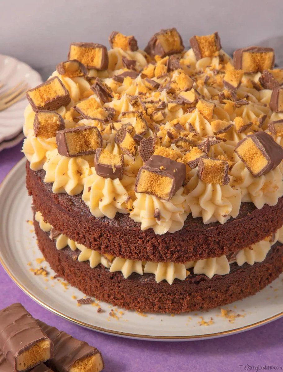 New! Crunchie Cake - a moist chocolate cake made extra fudgey by using brown sugar. It's filled and topped with a golden buttercream, infused with sticky golden syrup. Get the full recipe: buff.ly/3OmcsZr