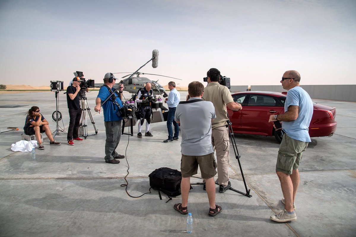 JohnFalchetto's tweet photo. As car enthusiasts lose their minds over the new Jaguar ad, throwback to shooting the @jaguar XJR as it raced @jetman  in the Dubai desert. https://t.co/jYv4w6fUwm