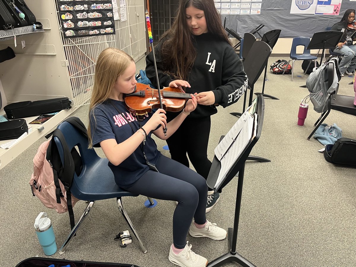 NIS_Orchestra's tweet photo. Life principle of the week “Fortitude” peers teaching peers how to shift on Silent Night. Working hard to elevated their playing skills. https://t.co/bEuEGR8YFX