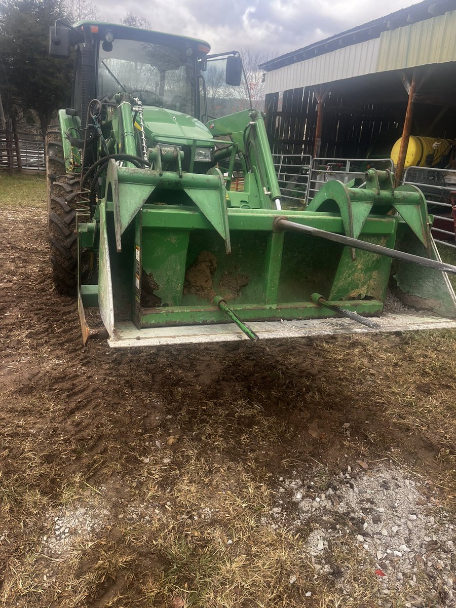 Spear in bucket in grapple trying to get what I need to next farm