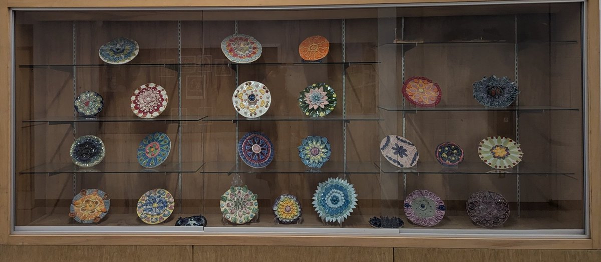 Check out the new art galleries around the building including this Ceramics 1 showcase! Mandala designs using radial symmetry! I'm so proud of <a href="/LHSRI/">Lincoln High School</a> artists! 🙌