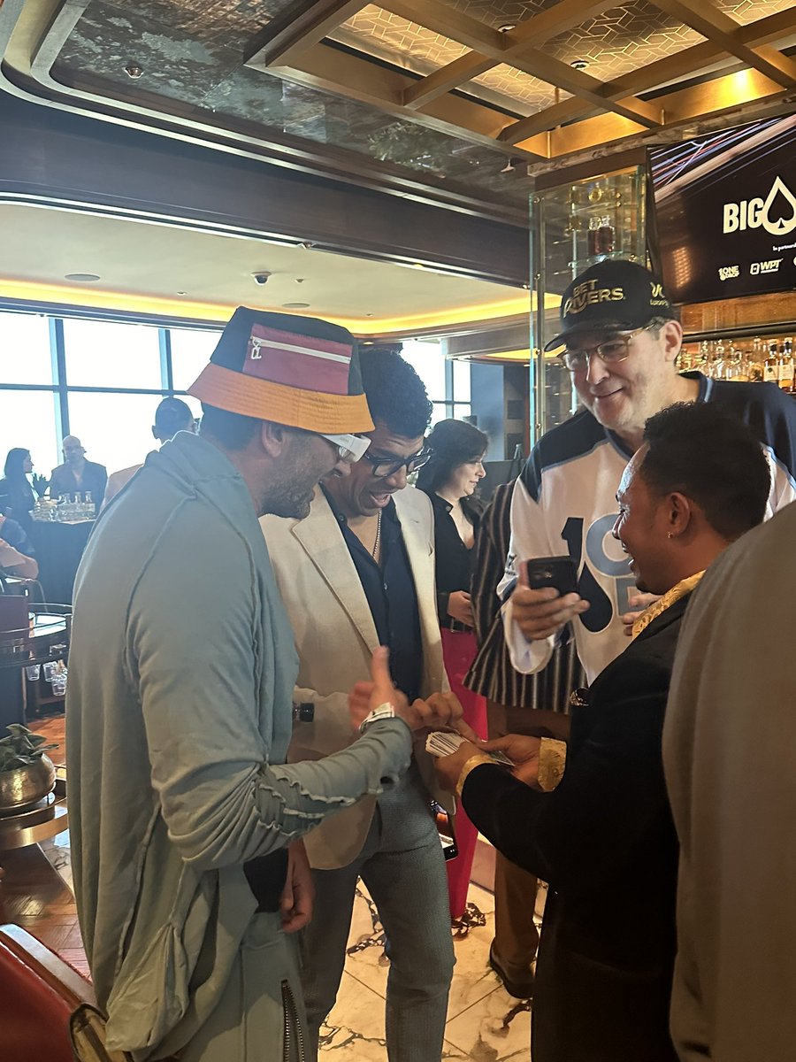 PokerNews (@pokernews) on Twitter photo There was a card magician entertaining at the Big Deal for <a href="/onedrop/">ONE DROP</a> today. Ironically, the magician was showing tricks to poker’s magician <a href="/MagicAntonio/">Antonio Esfandiari</a> along with <a href="/pliska007/">Adam Pliska</a> and <a href="/phil_hellmuth/">phil_hellmuth</a>! There was a card magician entertaining at the Big Deal for <a href="/onedrop/">ONE DROP</a> today. Ironically, the magician was showing tricks to poker’s magician <a href="/MagicAntonio/">Antonio Esfandiari</a> along with <a href="/pliska007/">Adam Pliska</a> and <a href="/phil_hellmuth/">phil_hellmuth</a>!
