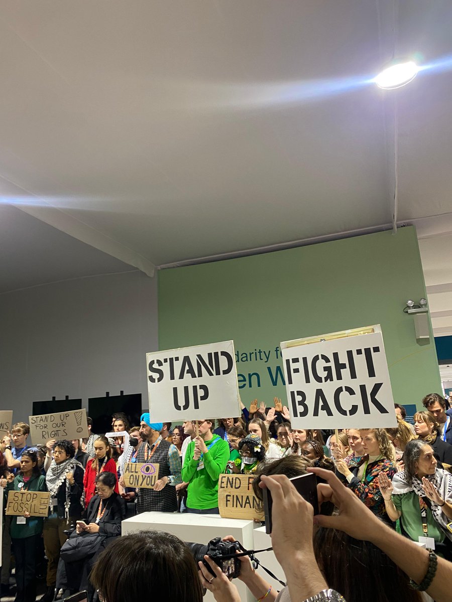 PowerShftAfrica's tweet photo. Happening Now: Civil society continues to hold the line this afternoon at #COP29!

With one united voice, they chant: "No deal is better than a bad deal!" https://t.co/ZPlRKv1ZmS