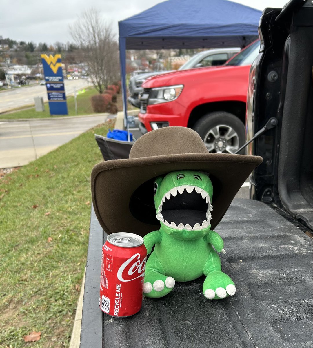 ⁦<a href="/AORacingUSA/">AO Racing 🦖</a>⁩ My 11yo brought Rexy to the WVU tailgate where he’s enjoying an age-appropriate beverage and enjoying the College Football vibe.