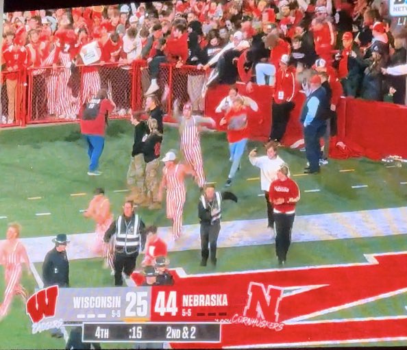Hassel_Chris's tweet photo. Nebraska rushing the field because they are finally bowl eligible https://t.co/cEfasnZVWA
