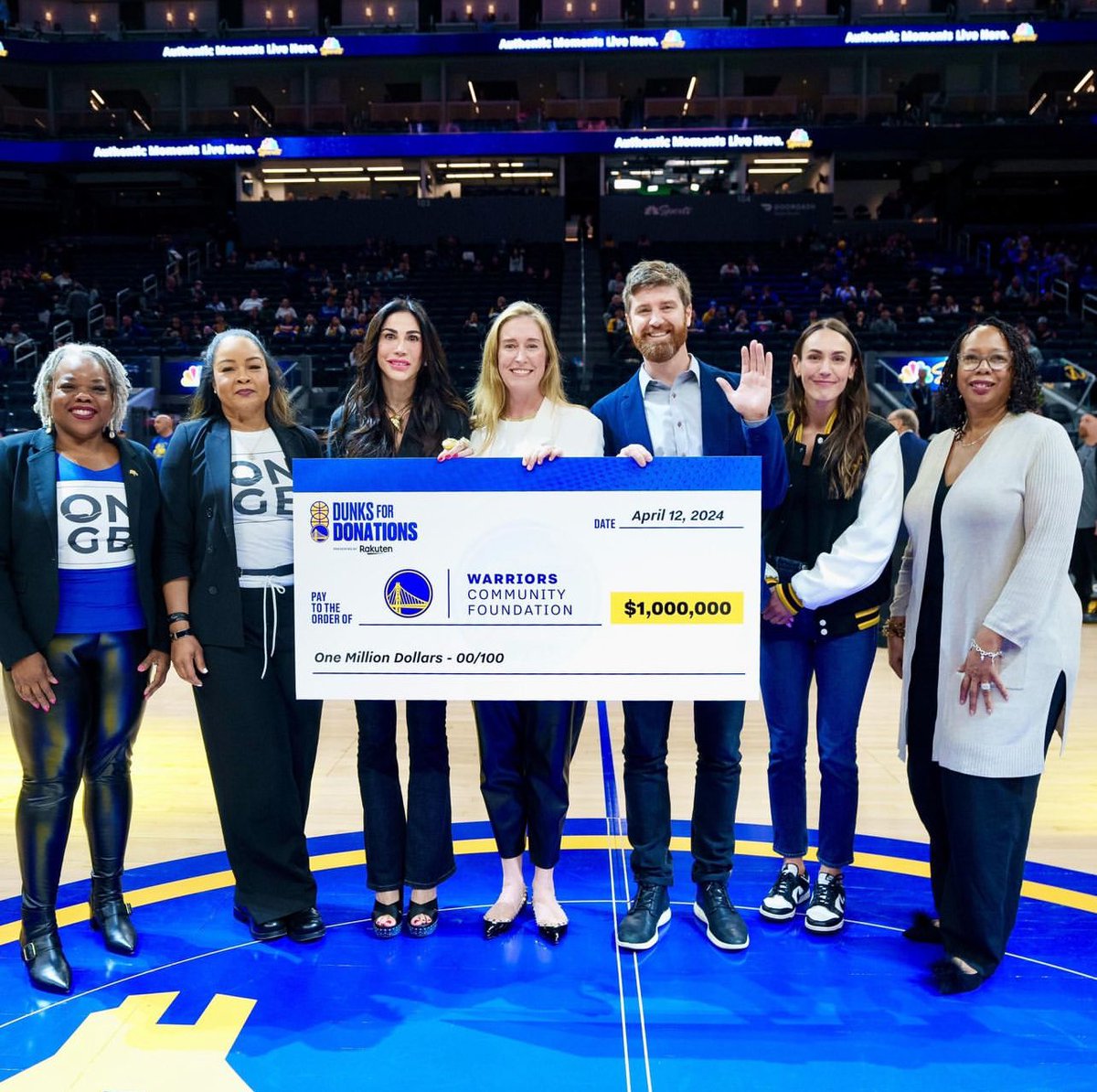 COO Adrienne Down Coulson and Director, Sustainability and Social Impact Miles Makdisi presented the Warriors Community Foundation with a $1M check for its educational grants program, capping this season's Dunks for Donations where Rakuten pledged $2,500 for every dunk.