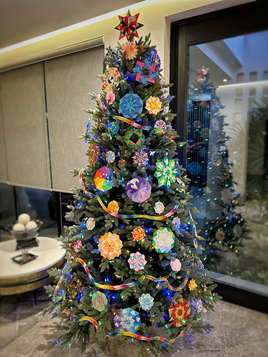 morigamiclub's tweet photo. We put up the tree! The garland is part of 1,000 cranes I folded in the 1980s; all other decorations are mandalas I designed and folded. If you want to fold decorations like these buy my book, "Magnificent Origami Mandalas", on Amazon! #origami #Christmastree #christmasornaments https://t.co/HVEsbAfWr6