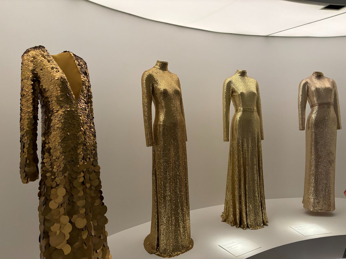 LaurenCDeutsch's tweet photo. The final section of the Met’s “Sleeping Beauties” exhibit was subtitled Mermaids. On one side of the wall there were four mermaid-cut dresses (tight at the thighs and flare out around the knee) all in gold sequins. The sequins resemble scales as well as the effect of the sun https://t.co/yyoe7IN70r