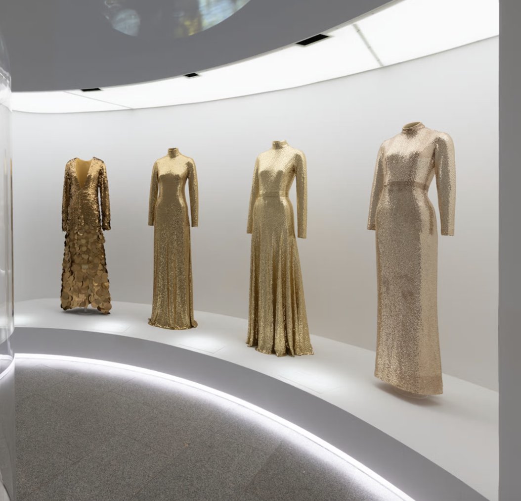 LaurenCDeutsch's tweet photo. The final section of the Met’s “Sleeping Beauties” exhibit was subtitled Mermaids. On one side of the wall there were four mermaid-cut dresses (tight at the thighs and flare out around the knee) all in gold sequins. The sequins resemble scales as well as the effect of the sun https://t.co/yyoe7IN70r