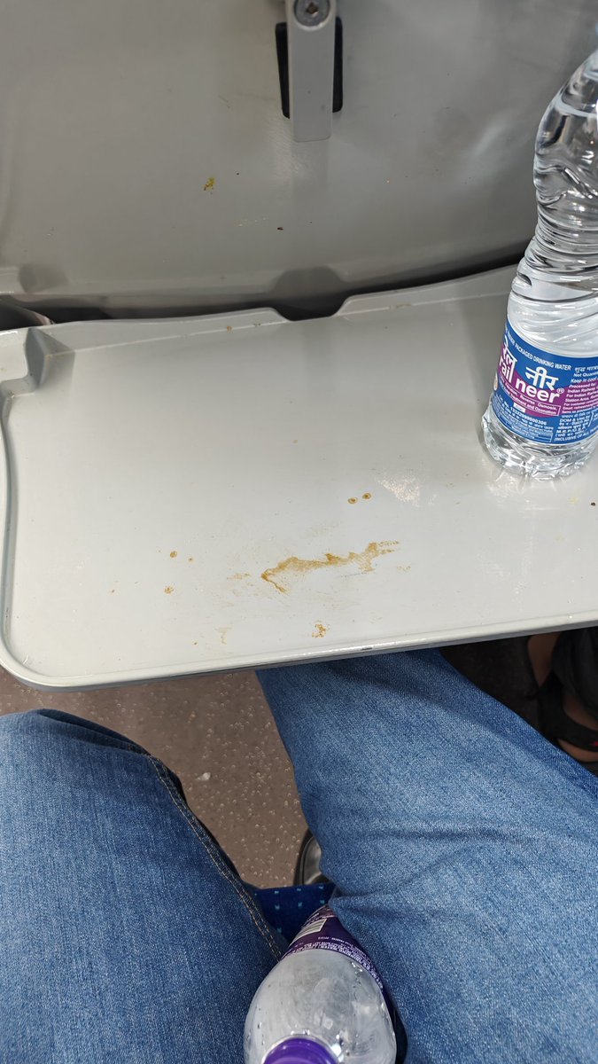 Anoop2309's tweet photo. @AshwiniVaishnaw @PMOIndia @RailMinIndia @RailwaySeva @nr_forum @Cmrail1 I am on train 22435 coach C10, seat 58, coach is filthy, garbage on floor, stained seat tables, is it really a premium Indian Train Vande Bharat? No one from the train crew is bothered https://t.co/JfGePEEtVS