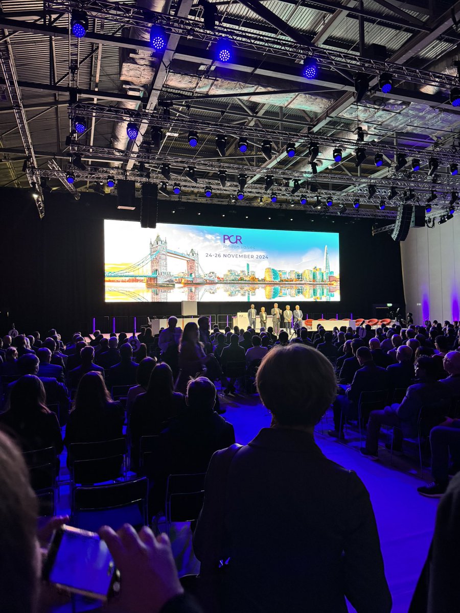 Edwin Ho (@edwinhomd) on Twitter photo Standing room only at the <a href="/PCRonline/">PCRonline 🫀</a> #LondonValves opening ceremony! Looking forward to a fantastic few days and hope to bring a little <a href="/MonteHeart/">Montefiore Heart</a> to the UK! <a href="/azeemlatib/">Azeem Latib</a> <a href="/m_assafin/">Manaf Assafin</a> <a href="/leoneppmd/">Pier Pasquale Leone</a> <a href="/drmaisano/">francesco maisano</a> <a href="/nicolo_piazza/">Nicolo Piazza</a> <a href="/didier_tchetche/">Didier Tchetche</a> Standing room only at the <a href="/PCRonline/">PCRonline 🫀</a> #LondonValves opening ceremony! Looking forward to a fantastic few days and hope to bring a little <a href="/MonteHeart/">Montefiore Heart</a> to the UK! <a href="/azeemlatib/">Azeem Latib</a> <a href="/m_assafin/">Manaf Assafin</a> <a href="/leoneppmd/">Pier Pasquale Leone</a> <a href="/drmaisano/">francesco maisano</a> <a href="/nicolo_piazza/">Nicolo Piazza</a> <a href="/didier_tchetche/">Didier Tchetche</a>