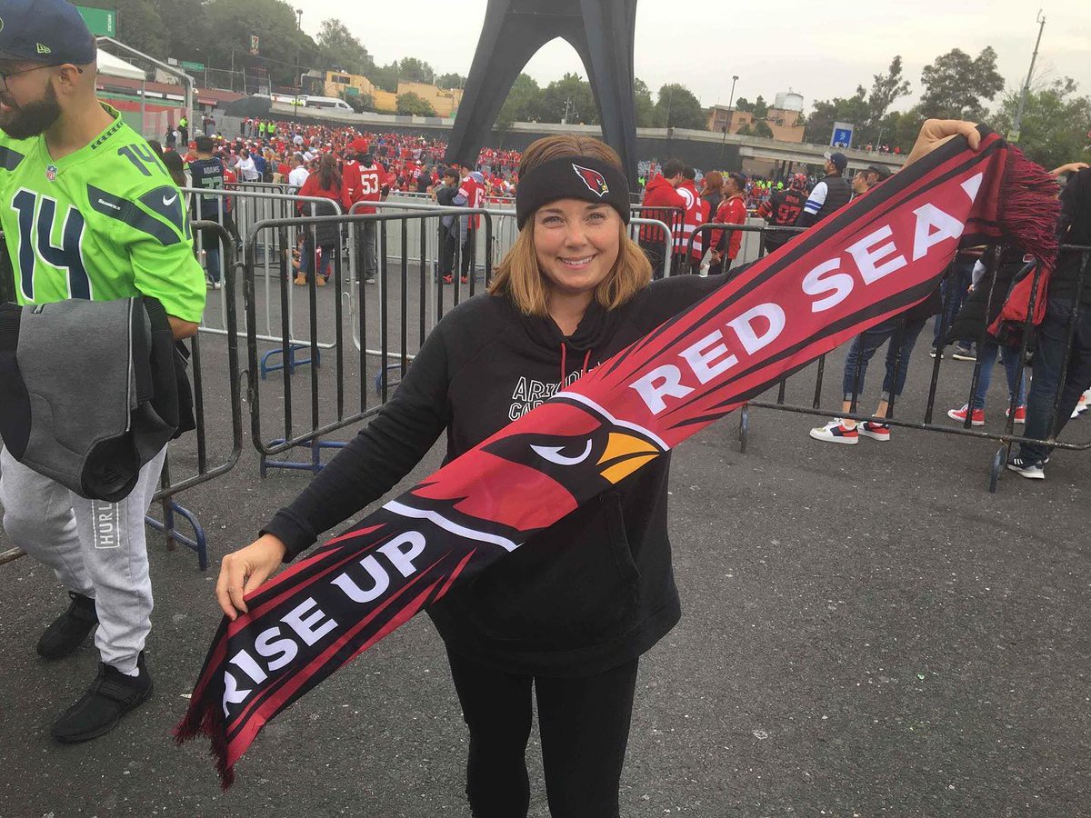 cardsfanjoanna's tweet photo. In honor of Seattle Seahawks day, here is a picture of me standing in front of a member of the "twelve" holding an Arizona Cardinals banner.

#NewProfilePic #RiseUpRedSea #BirdGang https://t.co/uepqqH06nG