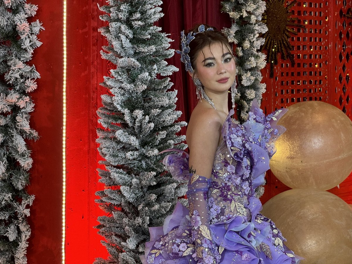 ABSCBNNews's tweet photo. LOOK: Fyang Smith radiates "big winner" energy in a stunning purple ensemble on the #StarMagicalChristmas2024 white carpet. | via @KrishnanGaniel https://t.co/2sGAJqIjkh