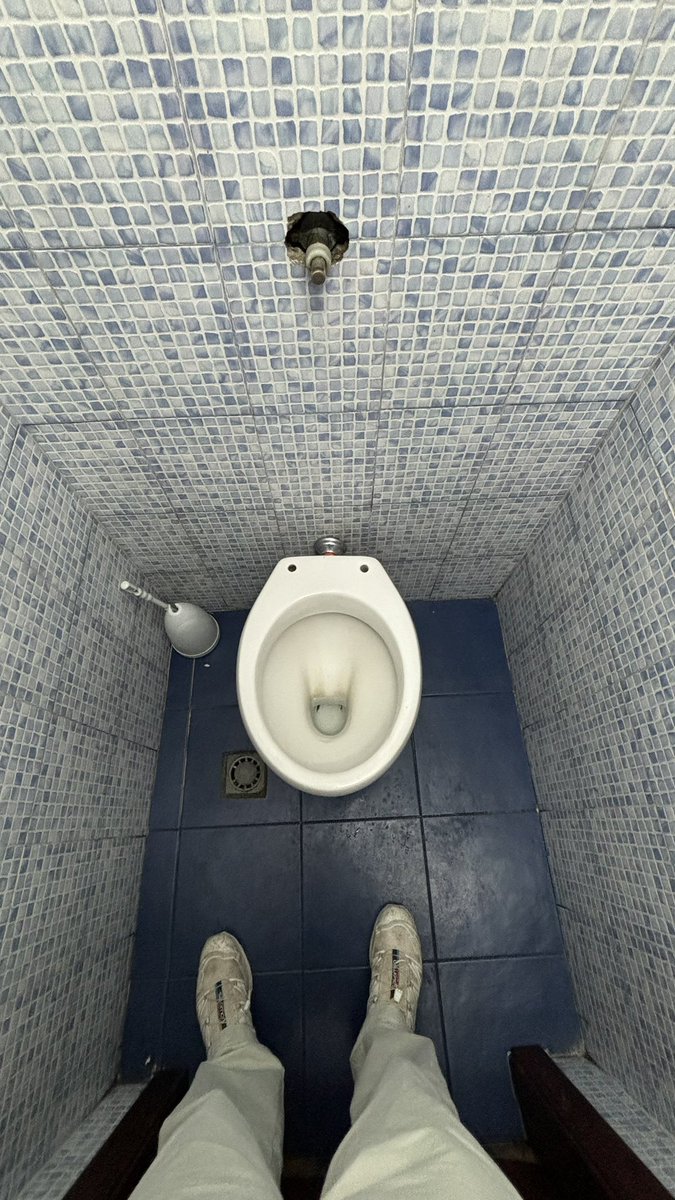 TSilverbeck's tweet photo. This is the average toilet in Palermo. They utilise the finest anti-shit technology. 
Notice no toilet seat, no toilet paper 
This means:
- No queues for the loo
- No cleaning fees 
- No stink in the cafe 
If you wanna shit, go home. Love this mentality. Bravo, Palermo. https://t.co/KK5m3wqys7
