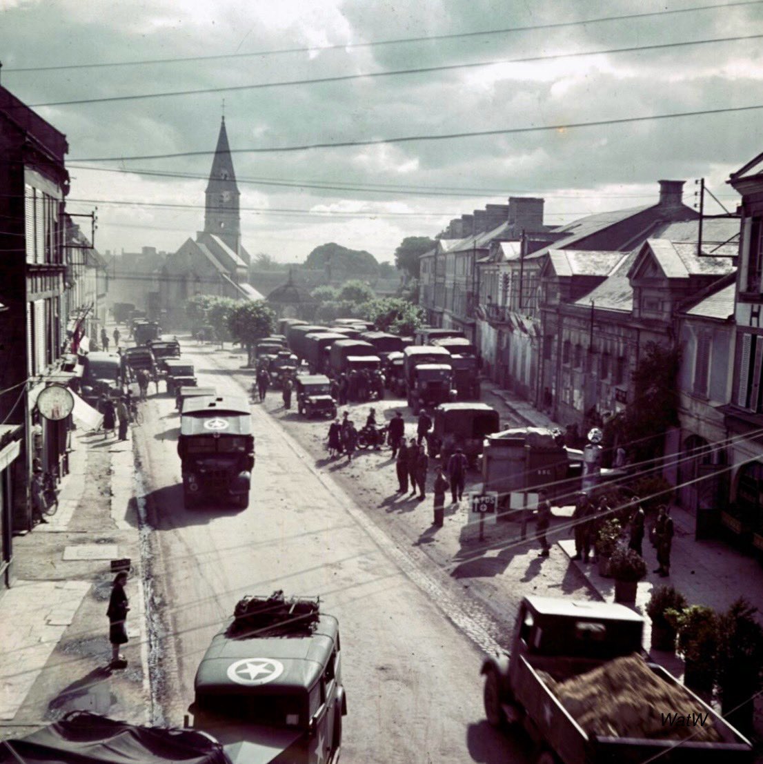 TheWorldatWar2's tweet photo. Canadian military vehicles; a Bedford QLD, Chevrolet C60L, Fordson WOT2 and an Austin on the Rue de Bayeux in the French town of Creully after its liberation - July 1944 #chevrolet #austin #fordson #canadian #creully #france #liberation https://t.co/vr1wH8PXjp