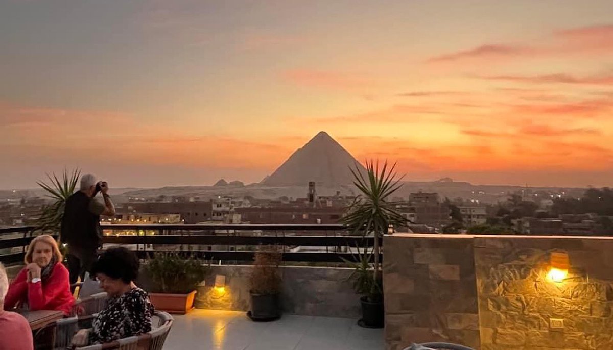 Golden hour with a view of the majestic great Pyramid.

Enjoy breathtaking sunsets and unforgettable moments at Kemet Boutique Hotel’s rooftop terrace.

Tag someone you’d share this magical view with!  

kemetboutiquehotel.com
kemetexperience.com

#EgyptianSunset