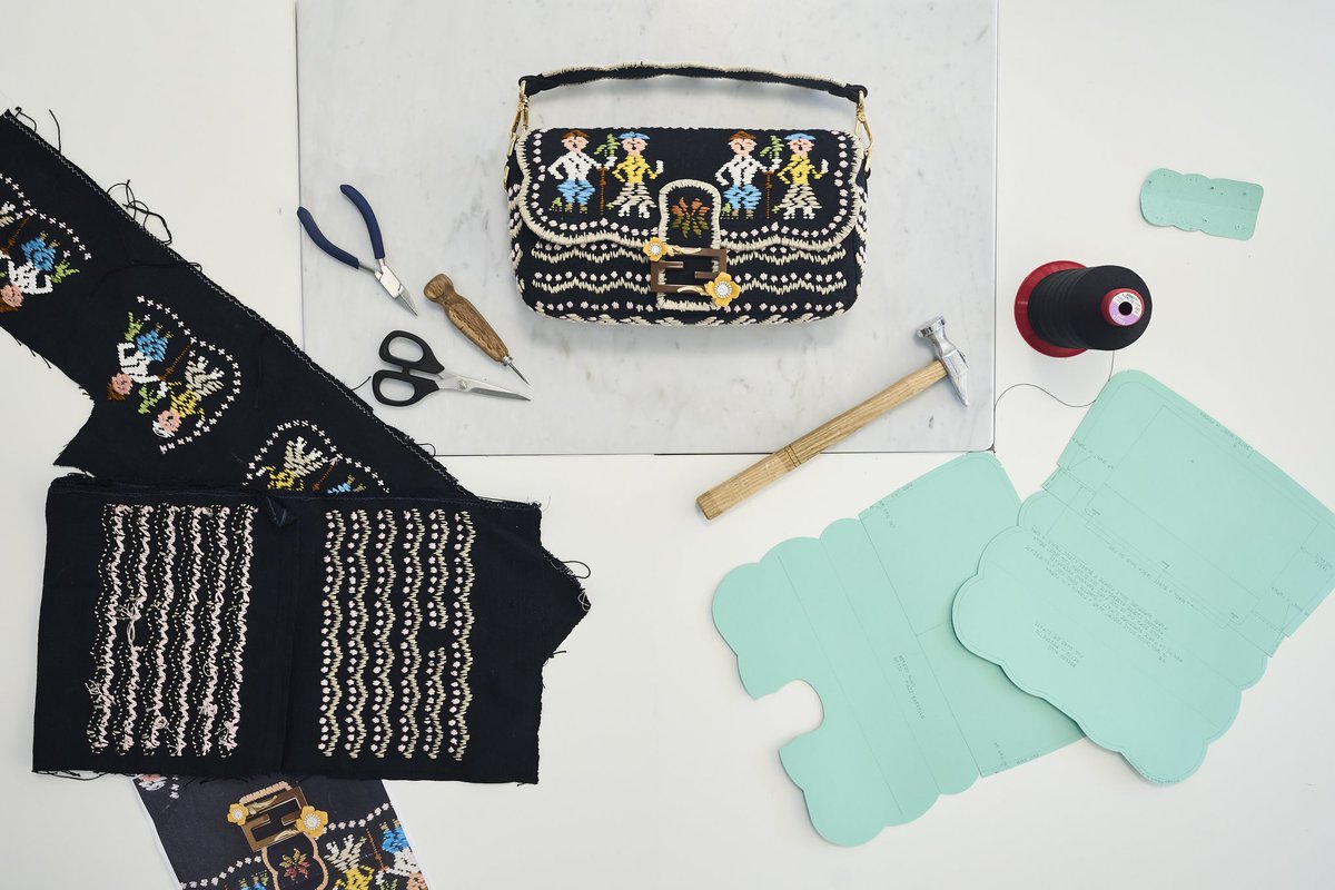 Fendi's tweet photo. The #FendiHandInHand project continues with a new wave of Italian artisans selected by Silvia Venturini Fendi to create iterations of the iconic #FendiBaguette according to local traditions.
From Calabria, Celestino Tessuti d'Arte has safeguarded a pictorial weaving technique since the 1930s. For their Baguette, the Celestino family recreated a whimsical, folkloric tableau from their archives entitled "The Procession".