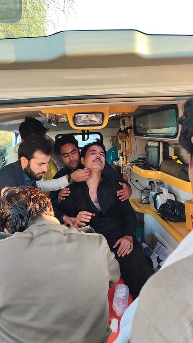 KP MPA Abdul Ghani is injured and is receiving treatment in an ambulance.