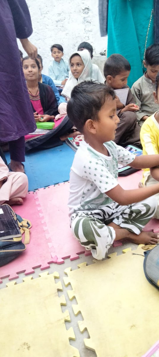 We are supporting The Alive and Shine Education Trust in Hyderabad, Pakistan. The school is a roofless building with a concrete floor where students sit on the floor.
We  found some foam floor tiles, so after a clean and a long trip by air, they arrived. The children love them.
