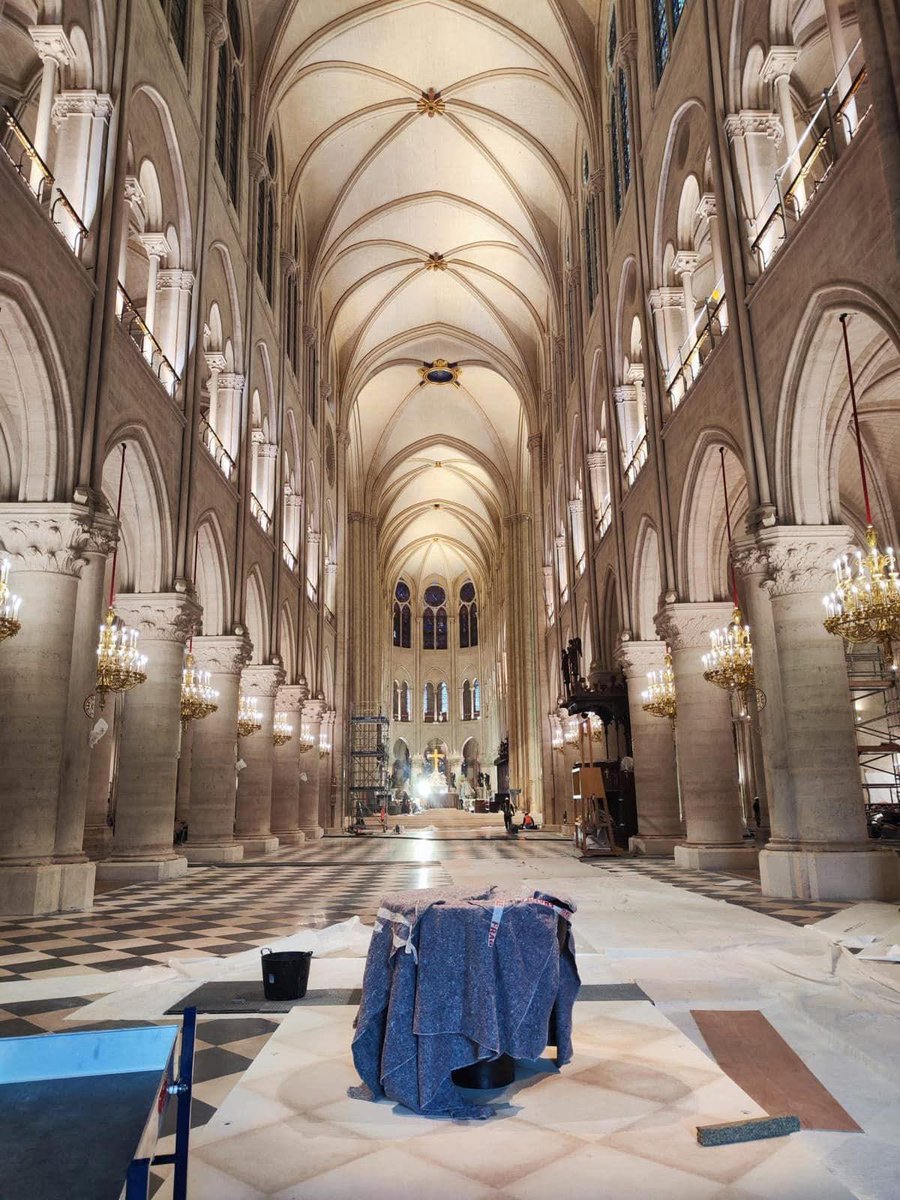 Before (left) and after (right) of the interior of Notre Dame.

Modernists lost this battle, so instead of a glass spire and partially destroyed vaultings everything was reconstructed as it was. Architects, for example, made sure that the former Medieval assymetrics  in the