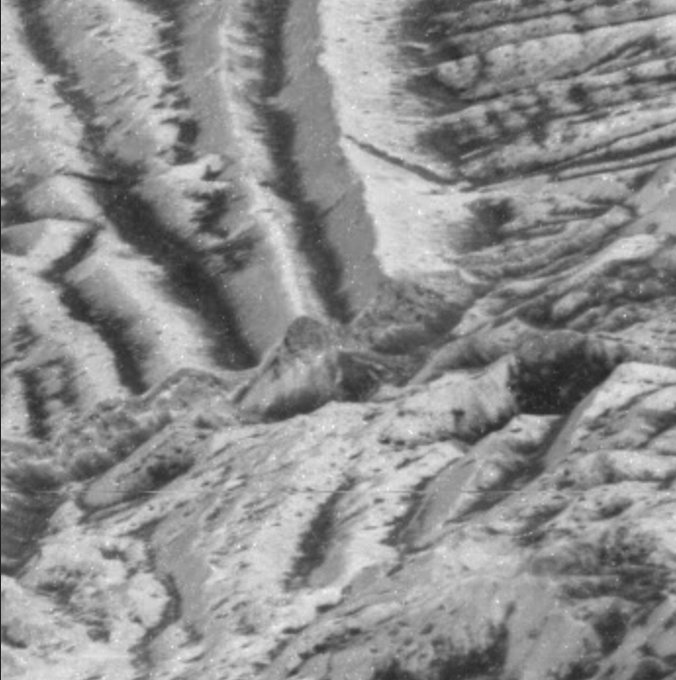 During its twelfth orbit around Jupiter, on Dec. 16, 1997, NASA's Galileo spacecraft made its closest pass of Jupiter's icy moon Europa, and took this image at a range of 560 kilometers (335 miles) and is the highest resolution picture of Europa obtained by Galileo. The image was taken at a highly oblique angle, providing a vantage point similar to that of someone looking out an airplane window. The features at the bottom of the image are much closer to the viewer than those at the top of the image. Many bright ridges are seen in the picture, with dark material in the low-lying valleys.