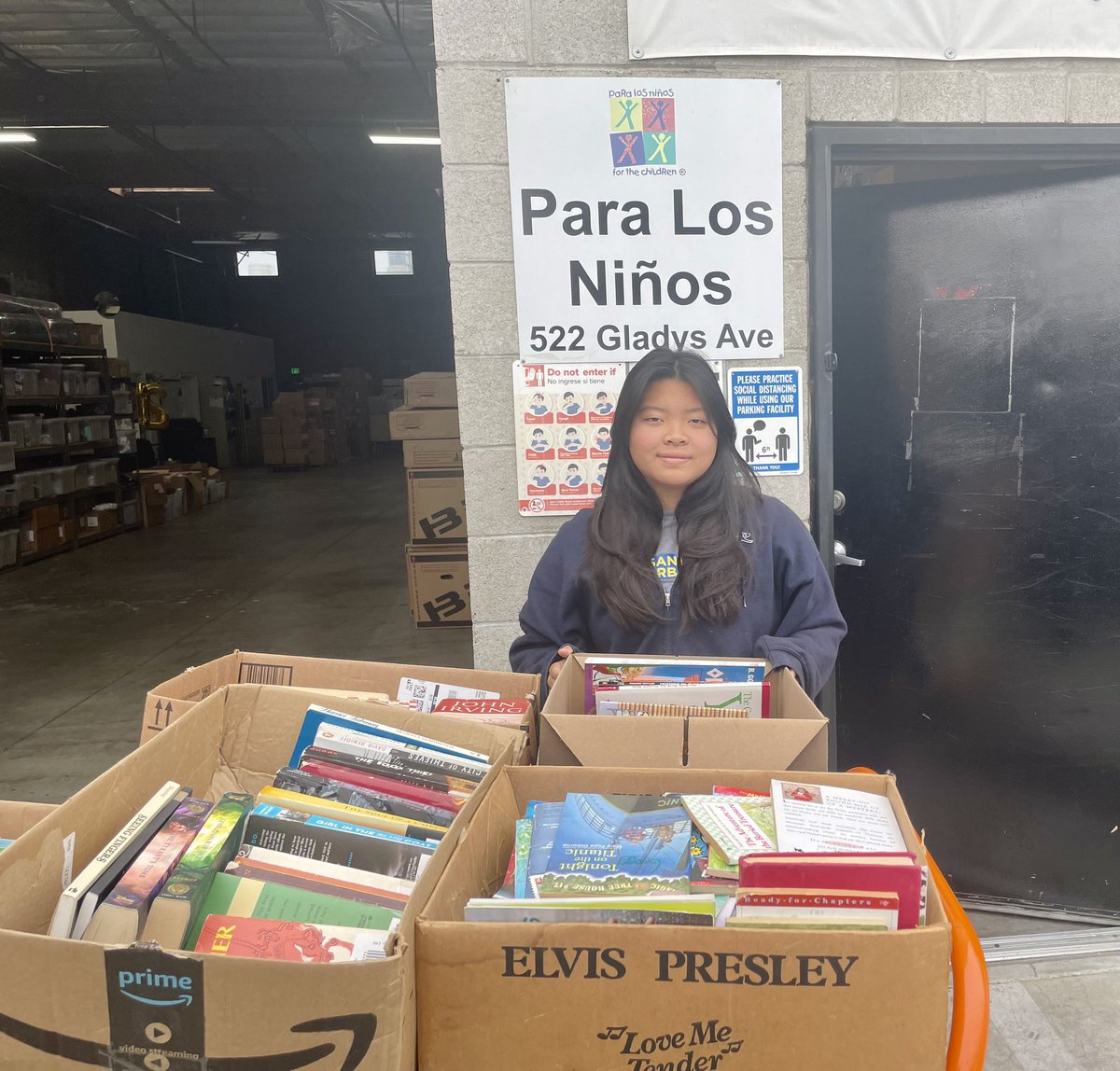 Caitlin dropped books <a href="/paralosninosorg/">Para Los Niños</a> for their holiday event. Families can select books for their at home libraries.