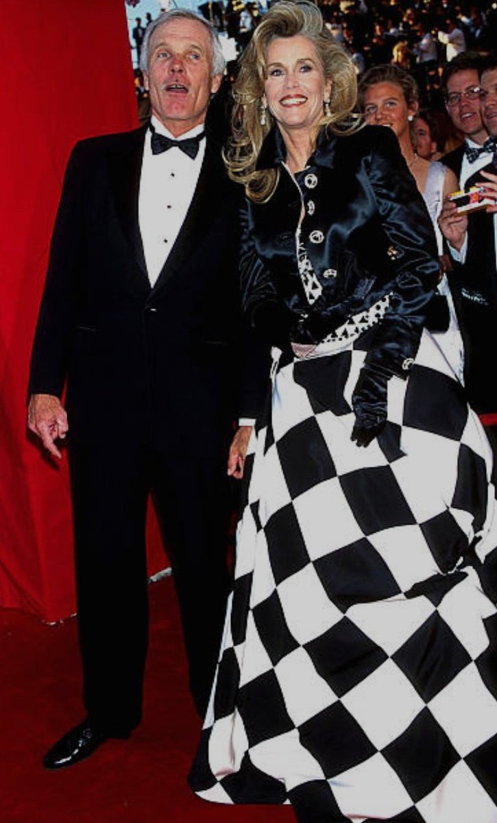 37Lemons's tweet photo. Two inverts arriving at the 
67th Annual Academy Awards

Female Ted Turner with
Male Jane Fonda in an absurdly blatant freemasonic checkerboard dress 

black, white, red https://t.co/FjS7Yk8gIj