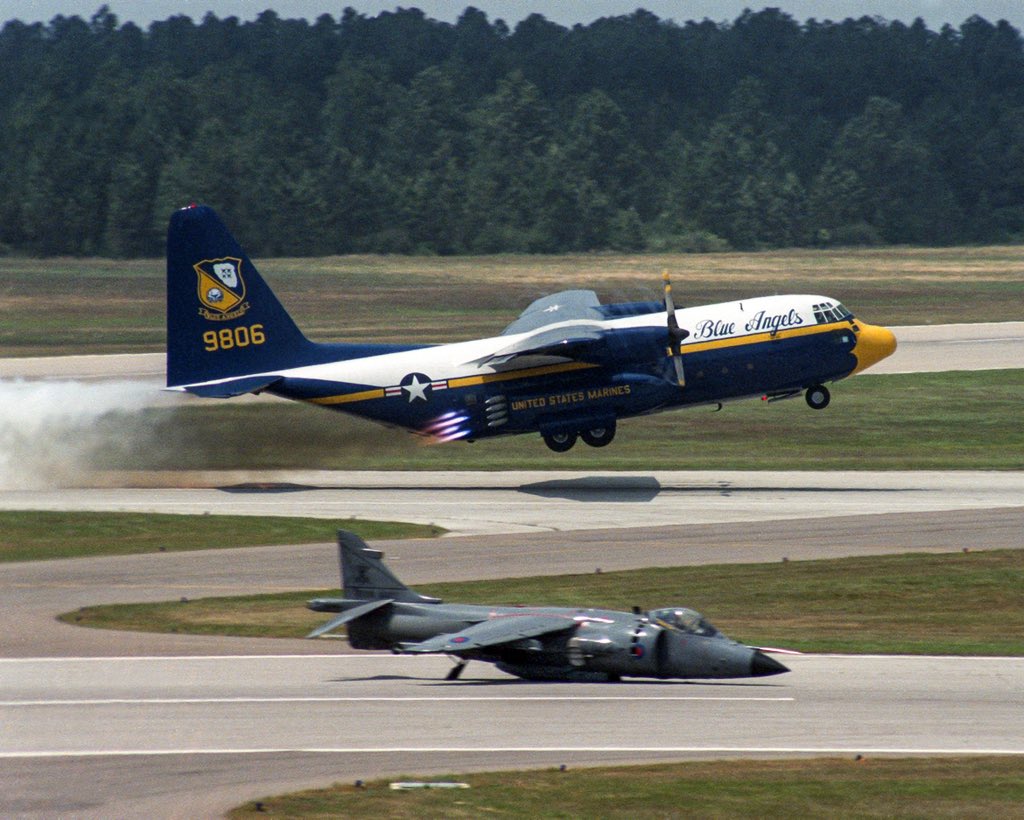 A USMC KC-130F and a British Royal Navy FRS Mark 1 Sea Harrier at Pensacola Naval Air Station May 1986.  (paquette)