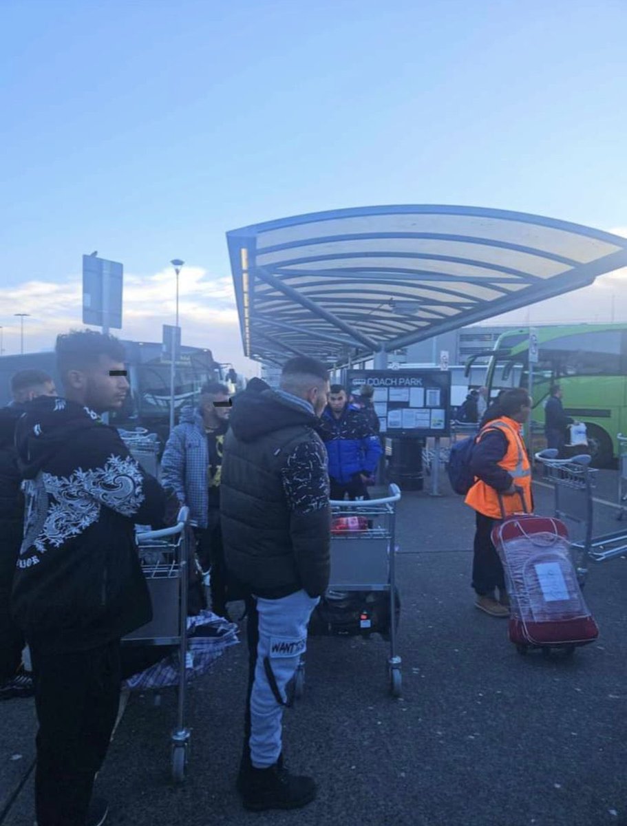 TheLiberal_ie's tweet photo. “We are being invaded” 🇮🇪
📍Dublin Airport, Sunday 9:30am
200 male-only migrants being loaded onto four private coaches.
They came from the airport terminal and were ushered onto private buses by officials in hi-vis jackets. #IrelandisFull 
Follow us for video updates and share https://t.co/kJPzbvD4P8