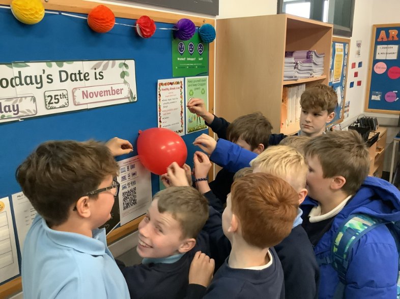 Do you want to know what happiness looks like?
The Primary 7 boys took great delight in popping  the second balloon to signify the last SEAG test!