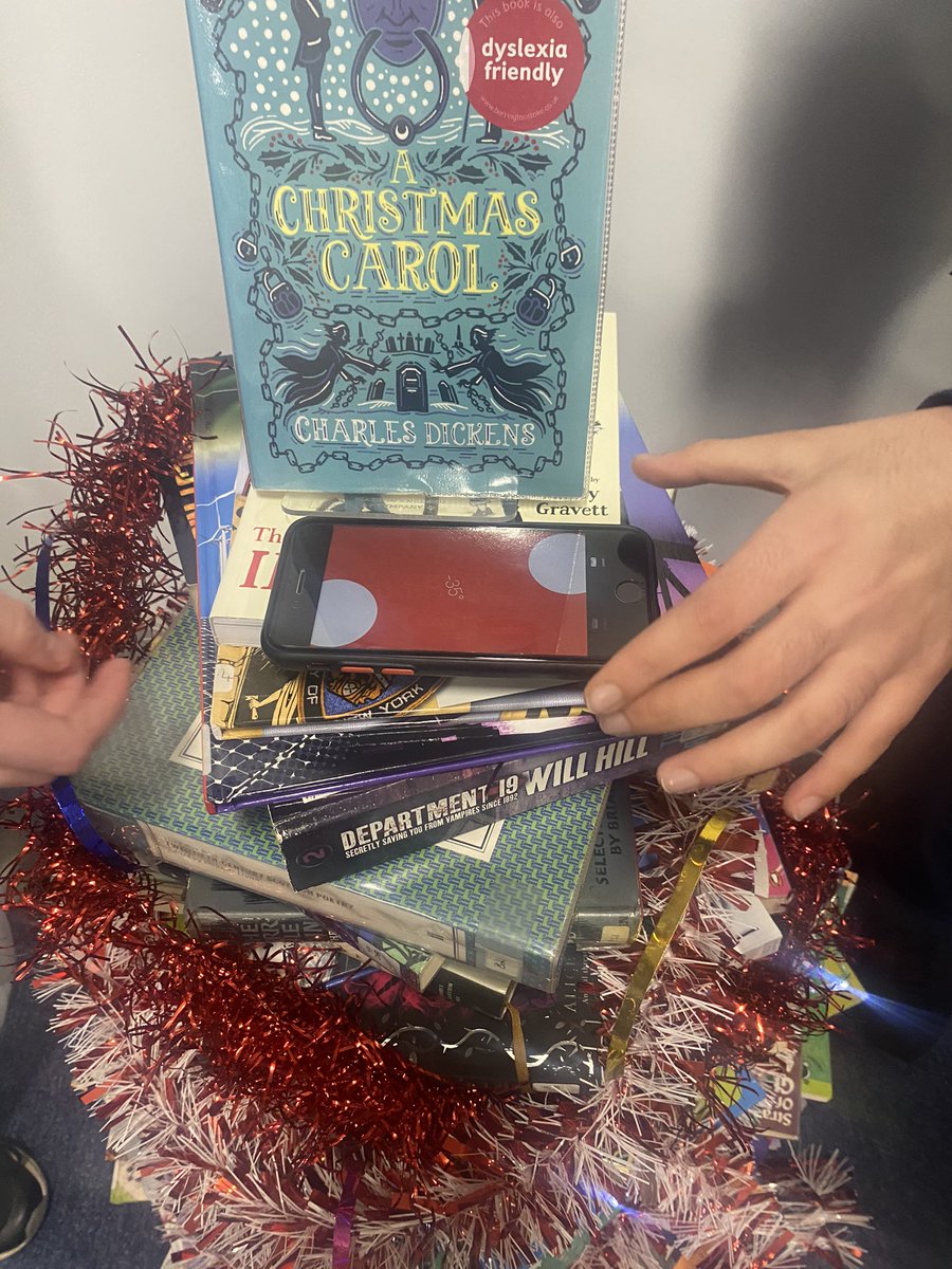 HyndlandL's tweet photo. The 3rd Annual @HyndlandSec Christmas Book Tree has been created. It’s taller than last year..and straighter. A spirit level was used this year 😆 Well done team. 3rd times a charm 🎄@HyndlandEnglish #readingschool #booktree https://t.co/lBITvW01DY
