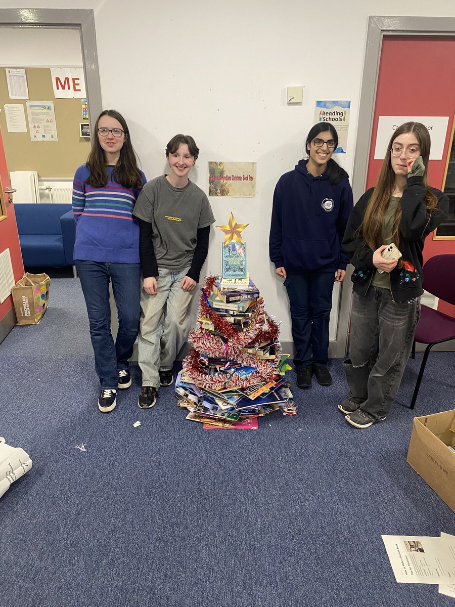 HyndlandL's tweet photo. The 3rd Annual @HyndlandSec Christmas Book Tree has been created. It’s taller than last year..and straighter. A spirit level was used this year 😆 Well done team. 3rd times a charm 🎄@HyndlandEnglish #readingschool #booktree https://t.co/lBITvW01DY