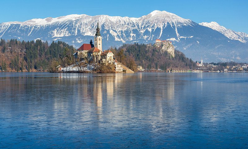 traveltipsx's tweet photo. Lake Bled is a postcard-perfect gem in Slovenia, surrounded by the Julian Alps and known for its fairytale beauty. 🏞️ Its emerald-green waters are home to Bled Island, where you’ll find a charming 17th-century church. Tradition says ringing the church bell brings good luck—so don’t miss it! 🔔

Towering above the lake is Bled Castle, a medieval fortress offering breathtaking views of the lake and surrounding mountains. For an unforgettable experience, rent a traditional pletna boat to reach the island, or hike up Ojstrica for the most iconic photo spot.

Lake Bled isn’t just famous for its stunning views—it’s also the birthplace of the mouthwatering kremšnita, or Bled Cream Cake! 🍰 This local dessert features layers of flaky puff pastry, creamy custard, and whipped cream, topped with powdered sugar.

Tip: Visit in early morning for calm waters and fewer crowds. Whether you’re paddling, hiking, or simply relaxing by the shore, Lake Bled is a magical destination that feels straight out of a storybook. 

#Slovenia #LakeBled