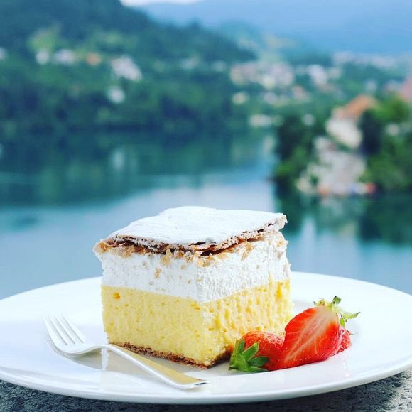 traveltipsx's tweet photo. Lake Bled is a postcard-perfect gem in Slovenia, surrounded by the Julian Alps and known for its fairytale beauty. 🏞️ Its emerald-green waters are home to Bled Island, where you’ll find a charming 17th-century church. Tradition says ringing the church bell brings good luck—so don’t miss it! 🔔

Towering above the lake is Bled Castle, a medieval fortress offering breathtaking views of the lake and surrounding mountains. For an unforgettable experience, rent a traditional pletna boat to reach the island, or hike up Ojstrica for the most iconic photo spot.

Lake Bled isn’t just famous for its stunning views—it’s also the birthplace of the mouthwatering kremšnita, or Bled Cream Cake! 🍰 This local dessert features layers of flaky puff pastry, creamy custard, and whipped cream, topped with powdered sugar.

Tip: Visit in early morning for calm waters and fewer crowds. Whether you’re paddling, hiking, or simply relaxing by the shore, Lake Bled is a magical destination that feels straight out of a storybook. 

#Slovenia #LakeBled