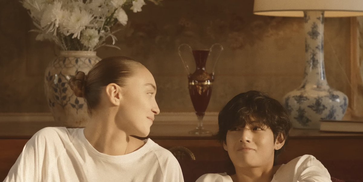 BTSgreenhouse's tweet photo. Taehyung in #WinterAhead: Even though these scenes look happy, the arrangement behind the woman has white chrysanthemum, the flower of mourning, and white scabiosa, which means unfortunate love. The mystery deepens… https://t.co/hAoRzeuYWS