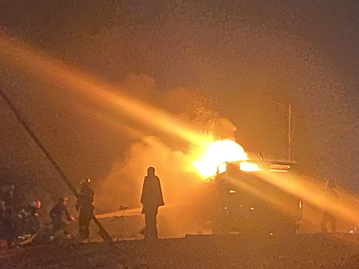 bgari11's tweet photo. Large fire at Goro. In front of Cambridge school. Burning Isuzu after gas tank caught fire while pumping gas. Driver drove it out of gas station and out of the road for safety. https://t.co/dCQOYZBjEx
