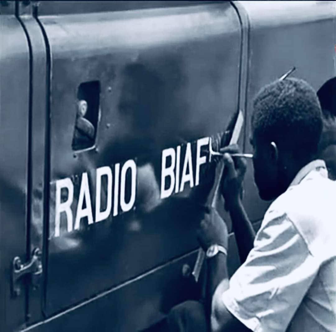 ChinasaNworu's tweet photo. Radio Biafra;

Colonel Obasanjo asked some of the Radio Biafra workers to accompany him to Lagos where they would be reabsorbed by Radio Nigeria. 

Radio Biafra had many prominent names. People like Chinua Achebe, Uche Chukwumerije and Cyprian Ekwensi made contributions. At the time the war ended in January 1970, it was headed by Sam Nwaneri.

Okokon Ndem’s voice was sharper than an AK -47 bullet. The way he made announcements, many Biafrans believed their troops were just miles short of capturing Gen. Yakubu Gowon alive.

It was believed that Radio Biafra operated from Enugu which had fallen into Federal hands as early as 1967. 

Many wondered how Gen. Emeka Ojukwu held on to that miracle.
However, the man who made Radio Biafra stay on, was Heron Okeahialam, an Electrical/Electronics engineer, trained in the United Kingdom. 

While he moved the station from one secret location to another, bullets and fighter bombers were unable to detect it. 

Prof. Okeahialam is his elder brother.
Prof. Okeahialam said: “Heron converted Radio Biafra from medium to short wave, for wider coverage.”

It was indeed a mobile station. It moved from Enugu to Umuahia and by the end of the war was operating from Obodoukwu Urualla in today’s Ideato area of Imo State.

“At one time,” Prof. Okeahialam added, “the transmitter was in Otulu during the war and a long palm tree was used to mount the aerial.”

Col. Olu Obasanjo who received the instrument of surrender as General Officer Commanding, Third Marine Commando Division of the Nigeria Army could not but marvel at what was Radio Biafra.

Locating it was like a wild goose chase. Accompanied by battle tested troops, Obasanjo waltzed through rough terrain in his official Mercedes Benz car, NA 116, until mission was accomplished.

He said:”The station was well camouflaged from both ground and air by trees and palm fronds which were changed regularly. It was a perfect job.”

Trust Obasanjo, he came battle ready and was after Okokon Ndem. The broadcaster outsmarted him by disappearing into the undergrowth. An enraged OBJ threatened to flog Ikoneto demons out of the man.

When Okokon Ndem eventually surfaced, the soldiers who would have been ordered to cane him were carried away. They hailed and took photographs with the non-Igbo Biafran.

Accompanying Obasanjo was another non-Igbo, Gen. Philip Asuquo Effiong, President of Biafra in the absence of Gen. Emeka Ojukwu who was flown out in his Grey Ghost by Captain Frank Osakwe.

Obasanjo asked some of the Radio Biafra workers to accompany him to Lagos where they would be reabsorbed by Radio Nigeria. Okeahialam declined. 

In 1976, he could not say no to Imo State Governor, Lt. Commander Ndubuisi Kanu.

Kanu saddled Okeahialam with the responsibility of setting up the Imo Broadcasting Service [IBS].

Okeahialam attended St. Joseph’s College, Sasse, Cameroon before proceeding to Professional Technial College, Southampton. He bagged a higher degree from the University of Cyracuse.

The engineer also lived up to his initials of H.O.D. when appointed H.O.D. Electrical/Electronics Engineering department, IMT Enugu.
Biafran scientists did great things. 

They made beer from cassava. Engine oil came out of coconut. They manufactured ‘Ogbunigwe’ rockets and built Red devil armoured cars. There were refineries. Airports sprang up in Uli, Uga and Obilagu.

Among the scientists were Gordian  Ezekwem, Col. Ejike Ebenezer Aghanya, Willy Achukwu,Frank Ndili, Felix Oragwu, Ezekiel Izuogu, Sam Orji, Frank Mbanefo, Benjamin Nwosu and Roy Umenyi. They belonged to the Research And Production Unit [RAP].

Source; vanguardngr

Photo courtesy of Beegeagles Blog.
@real_IpobDOS 
@radiobiafralive 
#FreeBiafra