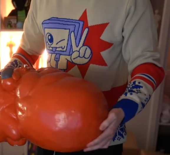 pk_kenzie's tweet photo. i designed @Pyrocynical new christmas jumper and beanie but he didnt send me pictures of it so i have to screenshot. i dont know what the orange thing is im sorry but that is not a part of it. its on his merch store pls buy it thank u https://t.co/CdSBYCP6rQ